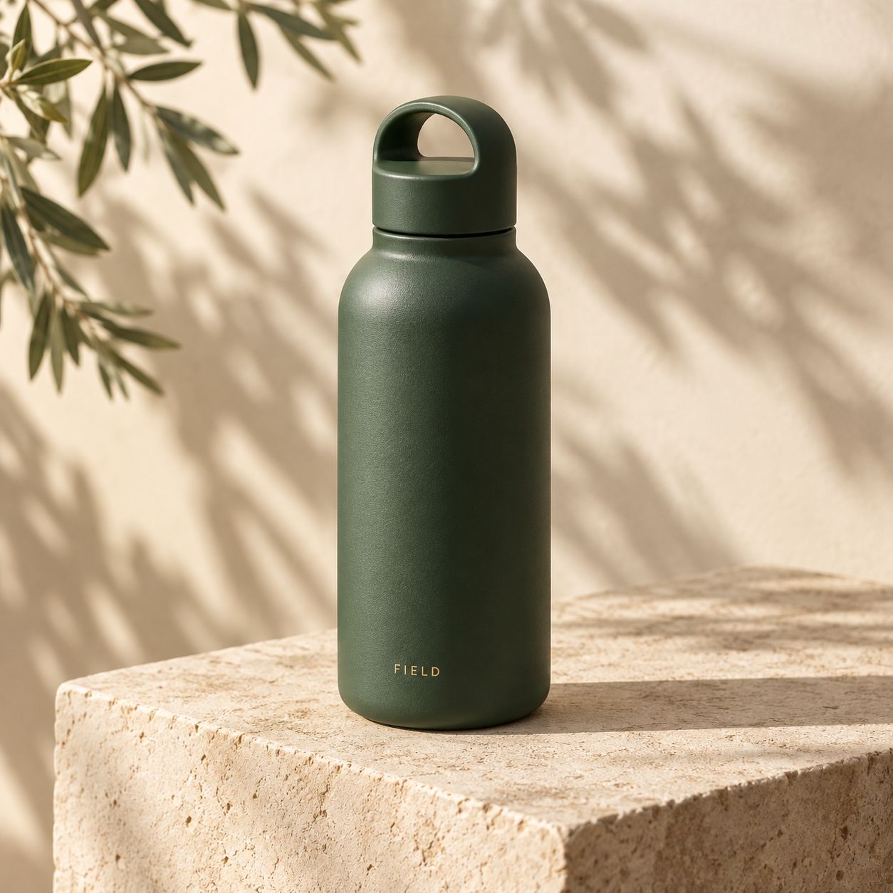 Fictional matte green Field bottle on a cream limestone plinth